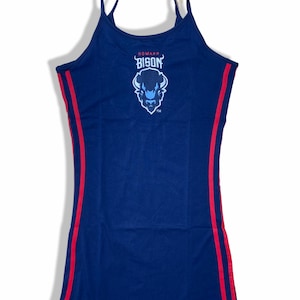 May include: A navy blue tank dress featuring thin spaghetti straps and two vertical red stripes running down each side. The chest area displays the text HOWARD BISON in red and white lettering above a graphic illustration of a bison head in blue.