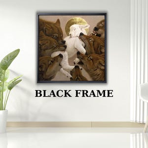 Könnte beinhalten: Ein gerahmtes Kunstwerk zeigt ein weißes Lamm, umgeben von braunen Wölfen, mit einem goldenen Heiligenschein. Der schwarze Rahmen kontrastiert mit der weißen Wand. Der Text "BLACK FRAME" steht darunter.