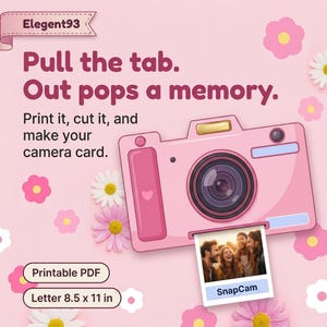 May include: A pink camera illustration on a light pink background with flowers. Text reads: "Elegent93", "Pull the tab. Out pops a memory.", "Print it, cut it, and make your camera card.", "Printable PDF", "Letter 8.5 x 11 in", and "SnapCam".