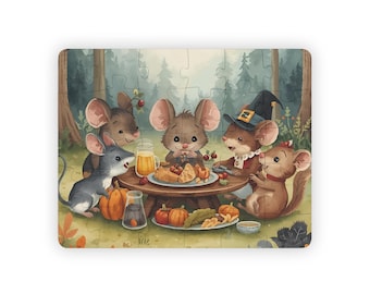 May include: A rectangular jigsaw puzzle featuring a watercolor illustration of five cartoon mice gathered around a table in a forest setting. The table is laden with food, including pumpkins and pie. The mice are various shades of brown and gray.