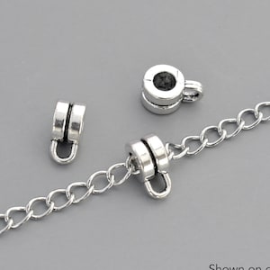 May include: Silver tone metal chain with two silver tone metal end caps. Shown on our 4x3mm stainless steel chain.