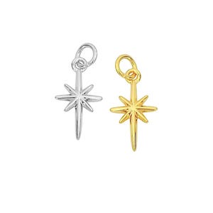 May include: Two silver and gold star charm pendants. The charms are in the shape of a six-pointed star with a loop at the top for attaching to a necklace or bracelet.