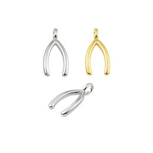 May include: Three silver and gold wishbone charms. The charms are in the shape of a wishbone and are perfect for adding a touch of whimsy to jewelry.