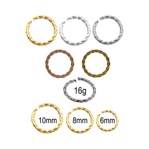 May include: A collection of circular twisted metal rings in various metallic finishes including gold, silver, copper, and bronze. The rings are labeled with sizes 16g, 10mm, 8mm, and 6mm. Each ring features a continuous twisted texture and a small gap.