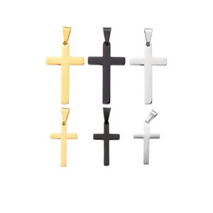 May include: Six pendant necklaces featuring a cross design. The crosses are in gold, black, and silver tones. The pendants are displayed against a white background.