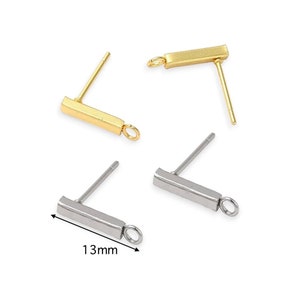 May include: Two pairs of earring findings, one pair is gold and the other is silver. Each finding has a straight post and a small loop at the end of a rectangular bar. The bar is 13mm long.