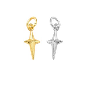 May include: Two gold and silver star charms with a pointed design. The charms are perfect for adding a touch of sparkle to jewelry.