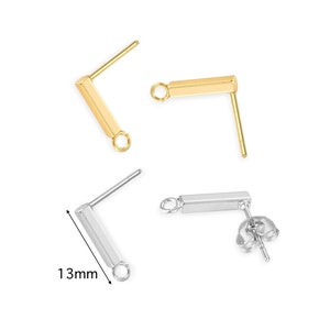 May include: Two pairs of earring findings, one pair is gold and the other is silver. Each finding has a straight bar with a loop at one end and a post with a butterfly back at the other end. The bar is 13mm long.
