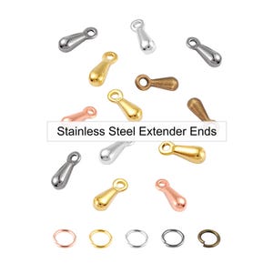 May include: A collection of stainless steel extender ends in various metallic finishes, including silver, gold, rose gold, and bronze. The image also shows small jump rings in matching colors. Text on the image reads "Stainless Steel Extender Ends."