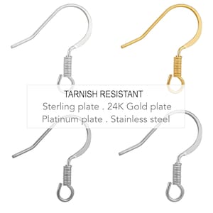 May include: Four earring hooks in different finishes: silver, gold, platinum, and stainless steel. The hooks are tarnish resistant and feature a spring-loaded closure.  Tarnish Resistant. Sterling plate. 24K Gold plate. Platinum plate. Stainless steel.