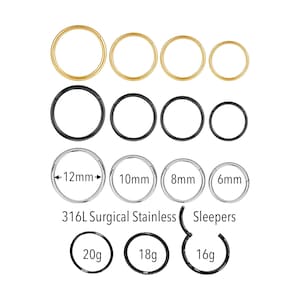 May include: An assortment of body jewelry, including gold and black circular hoop earrings. Sizes are labeled in millimeters and gauges, with the text "316L Surgical Stainless" and "Sleepers".
