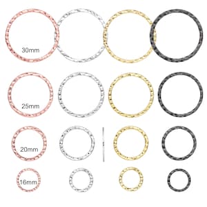 May include: Assortment of 16mm, 20mm, 25mm, and 30mm hammered metal rings in silver, gold, and black.