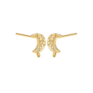 May include: A pair of gold-toned stud earrings shaped like crescent moons with a textured surface. Each earring features a small, clear embedded stone and a bottom loop for attaching additional jewelry components, complete with a straight post.