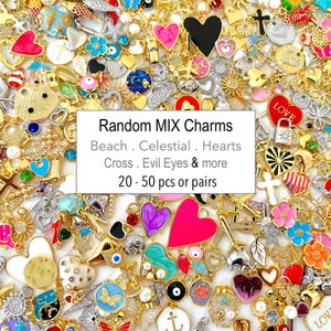 May include: A collection of gold-toned charms with various designs, including hearts, crosses, and celestial motifs. The charms are mixed with colorful enamel accents and small embellishments. Text on the image reads "Random MIX Charms" and lists charm types.