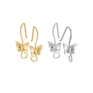 May include: Two pairs of butterfly earring hooks, one pair in gold and one pair in silver. The hooks are shaped like butterflies with delicate wings.