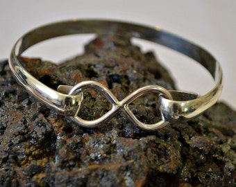 Sterling silver infinity bangle bracelet.  "Forever"