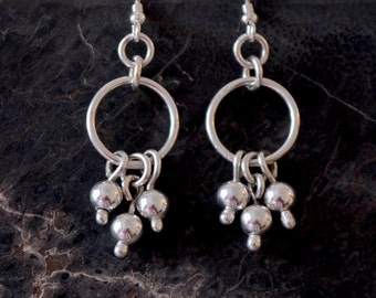 Sterling silver Cha Cha earrings.  hand made.  'Cha Cha Ching'