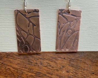 Solid copper earrings.  Patterned, light weight.