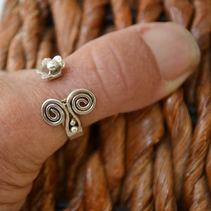 Adjustable thumb ring.  Sterling silver adjustable ring.