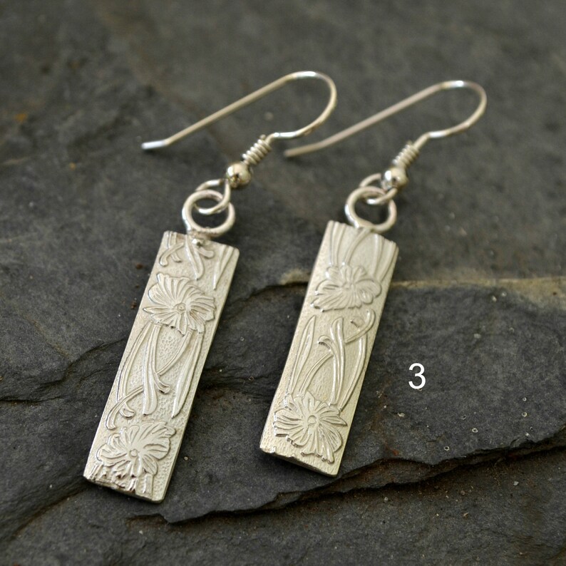 choose 1 2 sterling silver patterned earrings 3 or snakeskin hoops