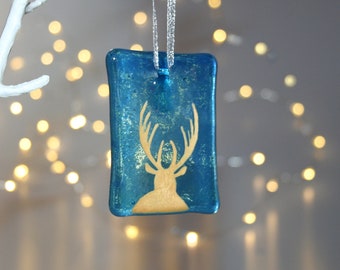 Fused glass stag ornament, hand painted fused glass stag Christmas decoration on transparent blue glass tile, front view