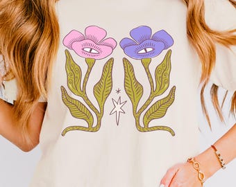 They Didnt Know We Were Seeds Flowers Eye Illustration Tee | Mystical Graphic Boxy Tee