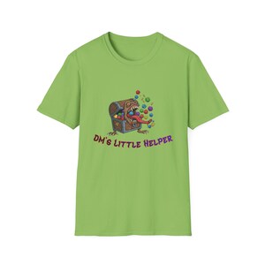 May include: A lime green t-shirt with a cartoon graphic of a treasure chest with a monster face, a long tongue, and dice. The text "DM's Little Helper" is below the graphic. The shirt is made of a soft material.