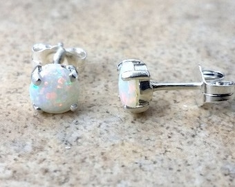 Genuine Opal 5mm(October Birthstone) stud earrings in Sterling Silver.