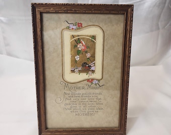May include: A framed print with a poem about motherhood. The poem reads "Mother Mine! New friends and old friends and best friends ever, And only one love that time cannot sever, And this is the love - when gone is all other - With which we were blest when God gave us MOTHER!"