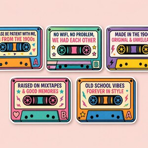 May include: Five retro cassette tape stickers in various colours. Each sticker has a different design and text, including phrases like "No wifi, no problem, we had each other" and "Old school vibes forever in style". The stickers have a vintage aesthetic.