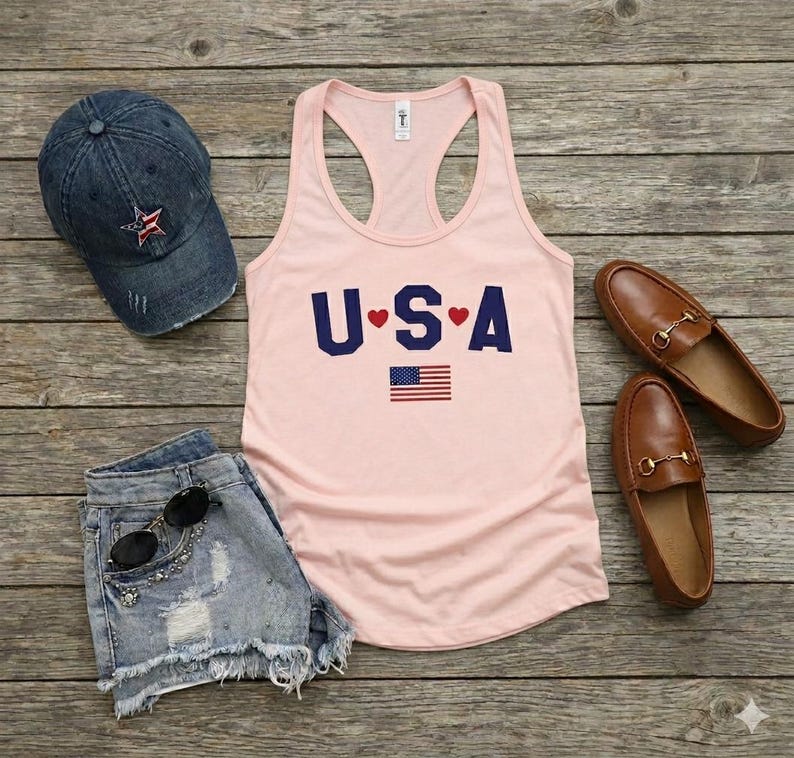 USA Flag Tank Top, perfect for the 4th of July and summer celebrations. This patriotic red, white, and blue tank top features the American flag design, ideal for Independence Day festivities. Whether you’re attending a parade or a BBQ, this tank is the perfect way to showcase your American pride. A thoughtful gift for anyone who loves to celebrate the USA!