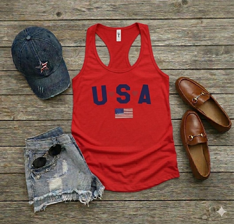 USA Flag Tank Top, perfect for the 4th of July and summer celebrations. This patriotic red, white, and blue tank top features the American flag design, ideal for Independence Day festivities. Whether you’re attending a parade or a BBQ, this tank is the perfect way to showcase your American pride. A thoughtful gift for anyone who loves to celebrate the USA!