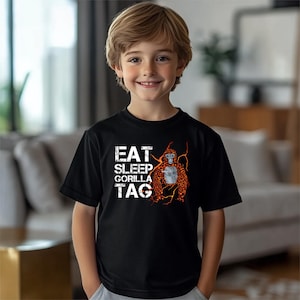 a young boy standing in front of a couch
