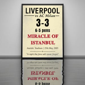 May include: A framed poster with the text "LIVERPOOL vs AC Milan 3-3 6-5 pens MIRACLE OF ISTANBUL" and the date "25th May 2005". The poster has a vintage design with a black frame.