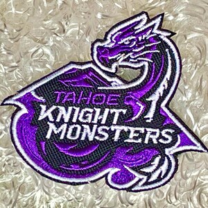 May include: Purple and white embroidered patch with a dragon and the text "TAHOE KNIGHT MONSTERS".