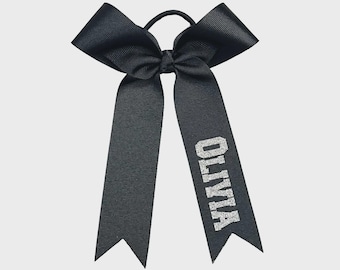 Light glitter dazzle college bows with 8 inch tails. Writing on bottom tail. Price is per skinny bow, College bows, collegiate bows, skinny