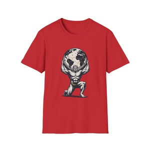 May include: A red t-shirt featuring a graphic of a muscular figure kneeling and supporting a globe. The globe is detailed with continents and oceans. The design is in black and white.