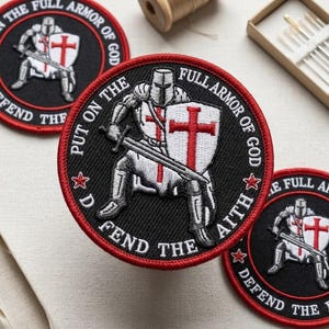 May include: Embroidered black patch with a red border featuring a knight in armor holding a sword and shield with a red cross. Text includes "FULL ARMOR OF GOD", "PUT ON THE FAITH", and "DEFEND THE".