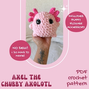 May include: A pink crocheted axolotl plushie with black eyes and pink frills. The text on the image says "AXEL THE CHUBBY AXOLOTL" and "PDF crochet pattern". Includes a puffy flower accessory. The image also says "NO SEW! < 30 MINS TO MAKE!"