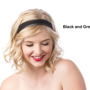 May include: A woman with blonde hair wearing a black headband. She is looking down and smiling.
