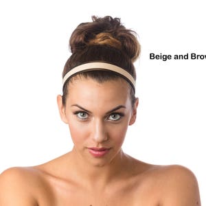 May include: A woman with brown hair is wearing a beige and brown headband. The headband is a simple design with a thin band of brown on the outside and a wider band of beige on the inside.