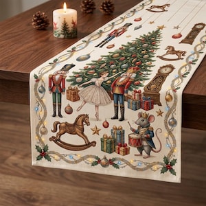 May include: A cream-colored table runner featuring a festive Christmas scene with a central tree, a ballerina, nutcrackers, a mouse drummer, rocking horses, wrapped gifts, and a grandfather clock, all framed by a garland with small lights.