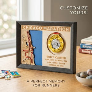 May include: A framed wooden display featuring a Chicago Marathon medal and a map of the city. The medal is gold and silver, with the text "Chicago 2026 Marathon." The frame includes the text "Chicago Marathon" and runner details.