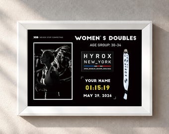 May include: A framed black and white print featuring a photo of an athlete, the text WOMEN'S DOUBLES, AGE GROUP: 30-34, HYROX NEW_YORK, OPEN_DOUBLES_SEASON_2025/2026, YOUR NAME, 01:15:19, MAY 29, 2026, and a white Hyrox branded wristband.