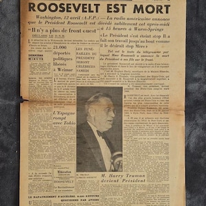 May include: A historical French newspaper dated April 13, 1945, with the headline "ROOSEVELT EST MORT". The newspaper includes a black and white photograph of a man in a suit and bow tie. The text is in French.