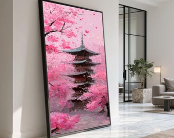 May include: A framed painting of a Japanese pagoda surrounded by pink cherry blossoms. The artwork features a multi-tiered pagoda with a gray roof, set against a backdrop of a pink sky and falling petals. The painting is in a black frame.