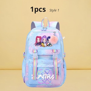May include: A light blue backpack with a colorful design, featuring a cartoon image of three girls and the word "UNTRA". The backpack has adjustable straps, a top handle, and a fluffy pink keychain. The text "1pcs Style 1" is at the top.