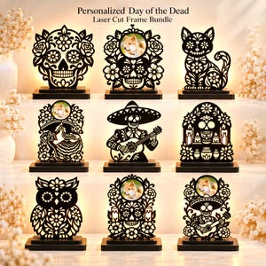 May include: A bundle of nine black laser-cut frames featuring Day of the Dead motifs, including skulls, a cat, an owl, and figures playing guitars. Several frames incorporate circular photo inserts showing a dog.