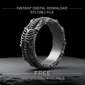 May include: A grayscale 3D-printed ring with a skeletal hand design. The ring is detailed with bone structures and is set against a dark background. Text at the top reads "INSTANT DIGITAL DOWNLOAD STL/OBJ FILE" and "FREE TEST STL/OBJ AVAILABLE" at the bottom.