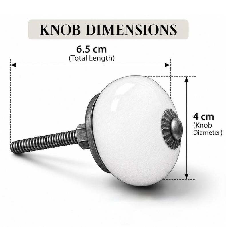 May include: A white ceramic cabinet knob with a dark metallic base and a decorative center cap. The text KNOB DIMENSIONS is displayed above. The total length is 6.5 cm and the knob diameter is 4 cm as indicated by the measurement lines.